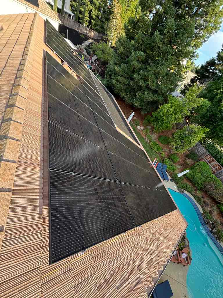 Solar panels mounted across a residential roof line